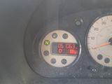 a close up of a car dashboard with a clock on it
