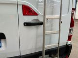 a ladder that is attached to the back of a van