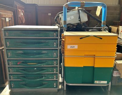 a cart that has many different colored drawers on it
