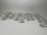 a lot of glasses that are sitting on a table
