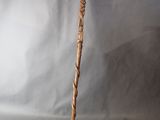 a close up of a wooden stick with a handle on a white background