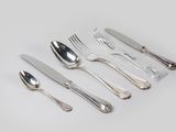 a set of silverware including a knife, fork, spoon, and spoon