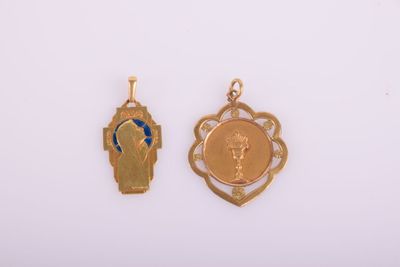 two pieces of gold and blue enamel on a white surface