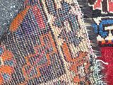 an image of a close up of a rug with a cat laying on it