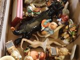 a box full of figurines sitting on a table