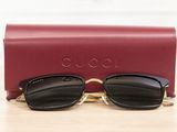 gucci sunglasses in black and gold with a red case