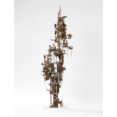 a sculpture of a tall tower with a clock on top of it