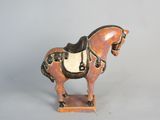 statue of a horse with a saddle on it ' s back