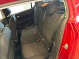 a red car with black seats in the back of it