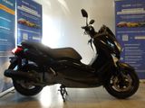 a scooter that is parked in a showroom