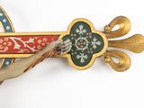 a cross with a crucift on it on a plate
