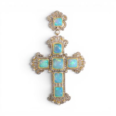 un pendentif en forme de croix en oplite et diamants