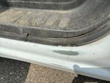 a close up of a car ' s door handle and the door handle is missing