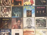 a lot of records on the wall of a room