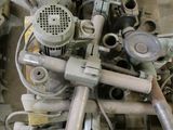a pile of assorted metal items sitting on a pallet