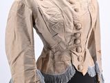 a close up of a mannequin mannequin with a jacket on it