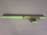 an image of a green pen sitting on top of a white table