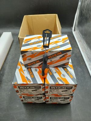 several boxes of orange soda sitting on top of a counter
