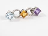 a close up of a ring with three different colored stones