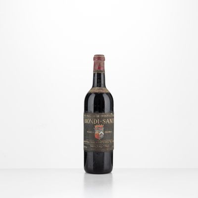 a bottle of red wine sitting on top of a table