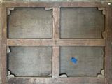 an old window with a blue sticker on it