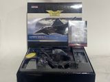 a black box with a batman batmobile model in it