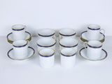 an image of a group of cups and saucers on a table
