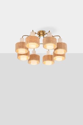 a close up of a light fixture with six lamps on it