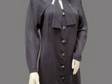 an image of a mannequin dressed in a black dress