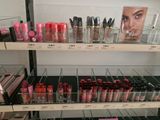 a lot of makeup products on the shelves in the store