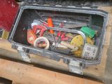 a tool box full of tools sitting on a table