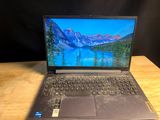 a laptop that is sitting on a wooden table