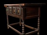 an old wooden table with a drawer on top of it