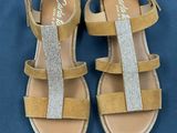 a close up of a pair of sandals on a blue surface
