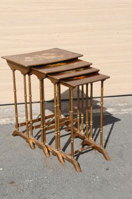 three tables that are sitting on the pavement