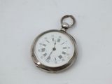 a silver pocket watch with roman numerals on it