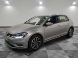 the volkswagen golf is parked in a clean room with a checkered floor