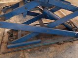 a blue scissor sitting on top of a table
