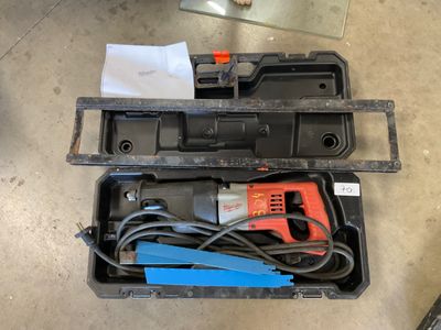 a tool box with tools in it sitting on the floor