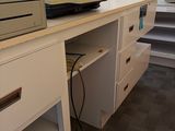 a printer sitting on top of a desk in a room