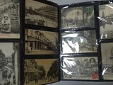a picture of a collection of old postcards in a folder