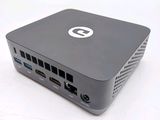 a small computer that is sitting on a white surface