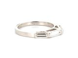 a close up of a ring with a baguet on it