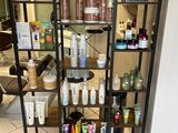 a shelf with many different types of hair products on it