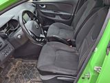 a picture of a green car with its door open