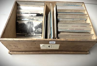 a wooden box with a bunch of records inside of it