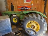 a tractor that is parked in a garage