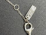 silver plated bracelet with a chain and a heart charm
