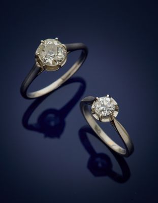 a pair of diamond rings on a blue background