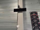 a sign that is hanging on the side of a building